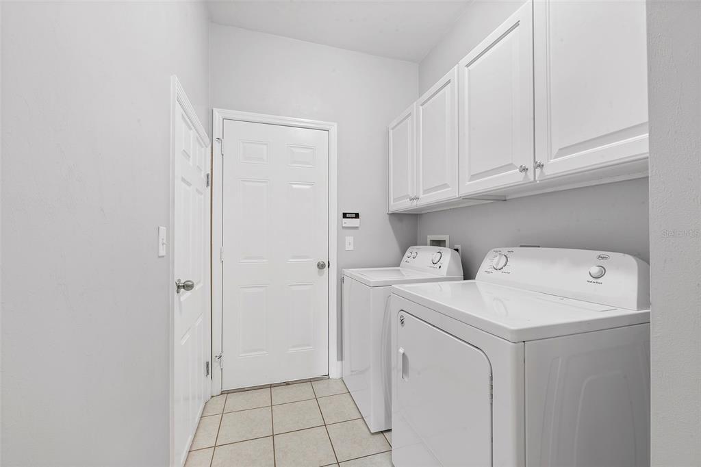 8376 Southwest 80th Place Gainesville, FL 32608 - Photo 26 of 37 a utility room with dryer and washer