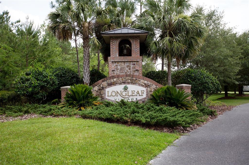 8376 Southwest 80th Place Gainesville, FL 32608 - Photo 31 of 37 a front view of a house with garden