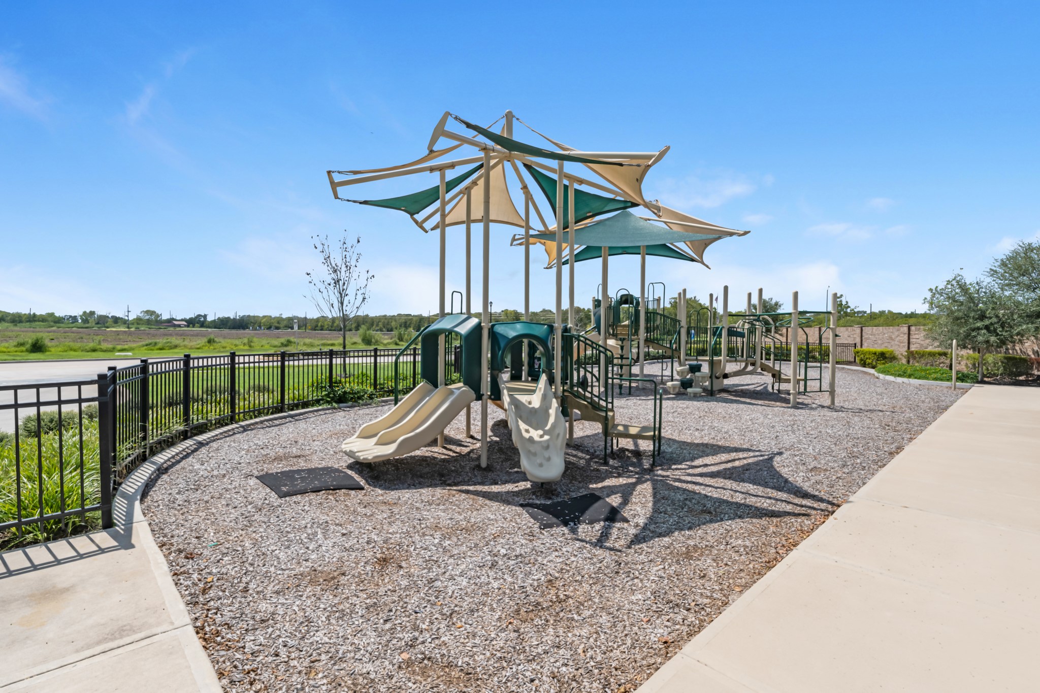 8738 Mallow Rose Way Rosharon, TX 77583 - Photo 13 of 16 a view of a park with a bench