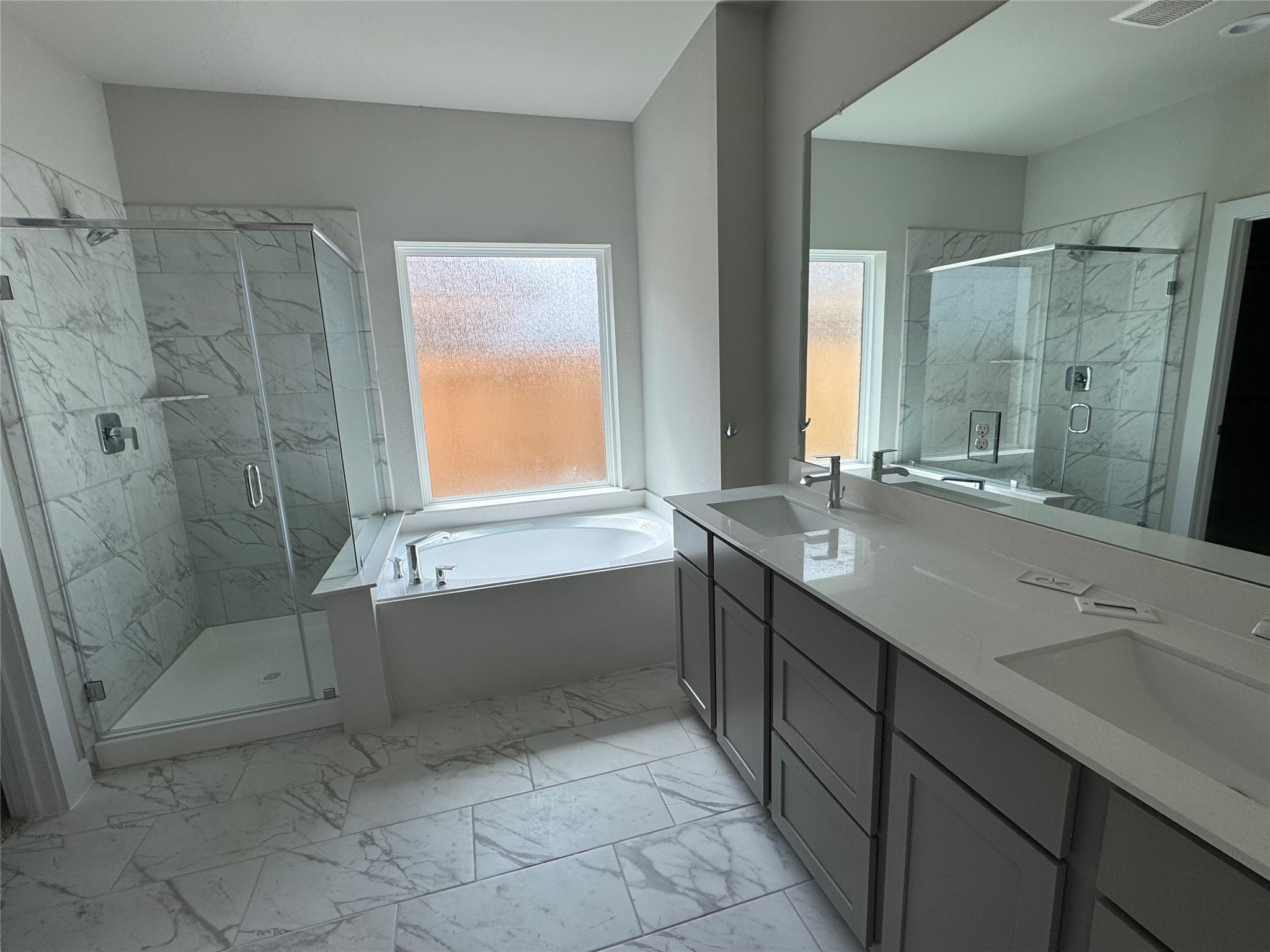 8738 Mallow Rose Way Rosharon, TX 77583 - Photo 2 of 16 a bathroom with a granite countertop sink mirror and a bathtub
