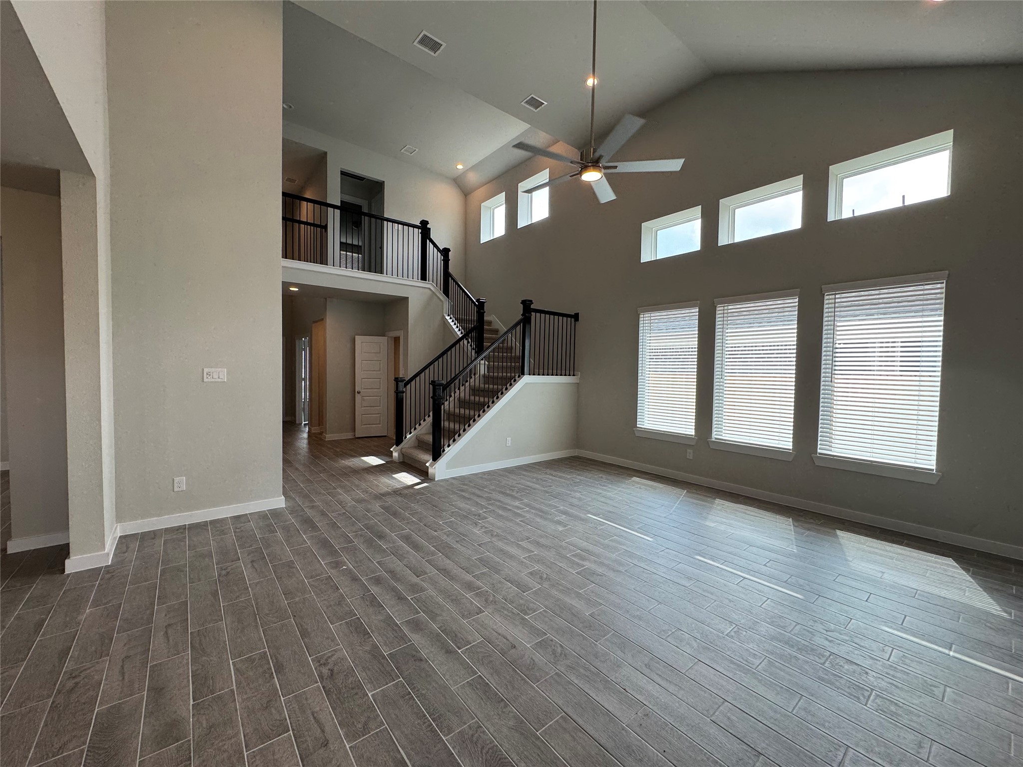 8738 Mallow Rose Way Rosharon, TX 77583 - Photo 4 of 16 a view of a livingroom with wooden floor and stairs