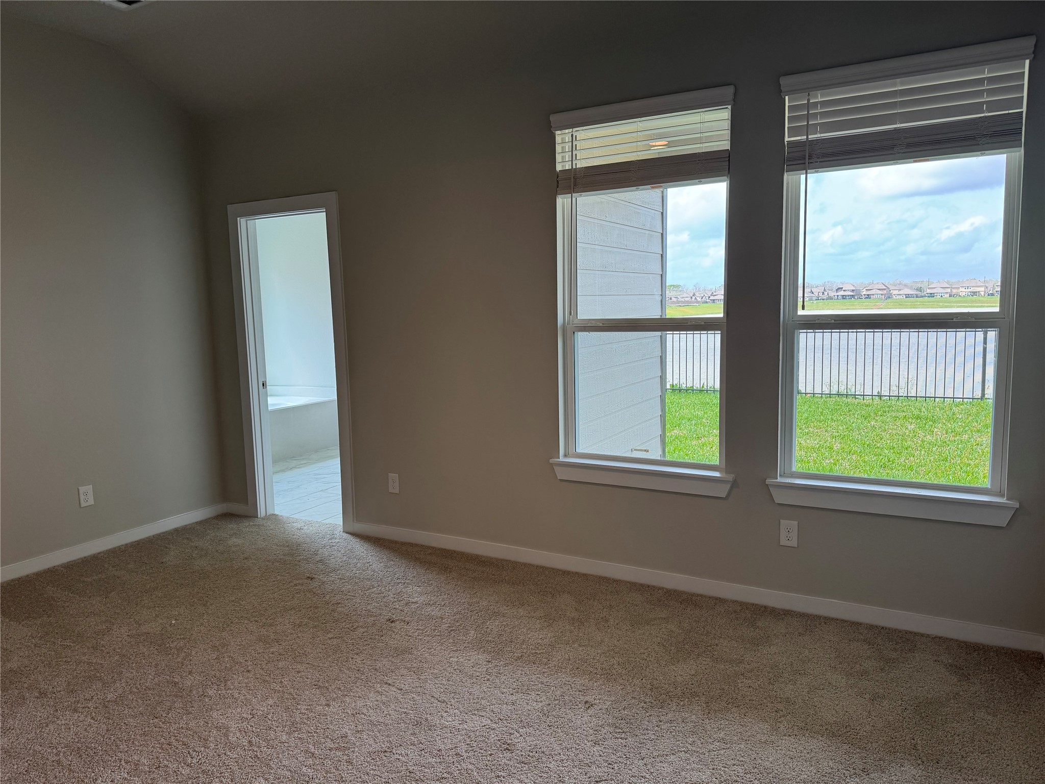 8738 Mallow Rose Way Rosharon, TX 77583 - Photo 5 of 16 an empty room with windows