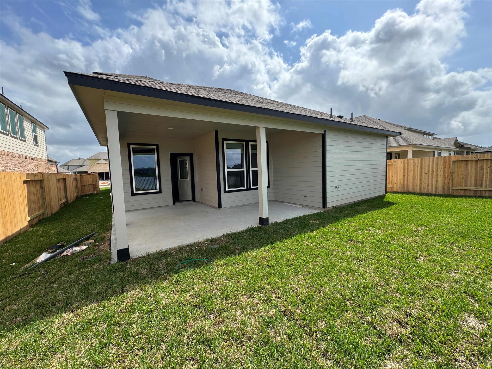 8738 Mallow Rose Way Rosharon, TX 77583 - Photo 7 of 16 a backyard of a house with lots of green space