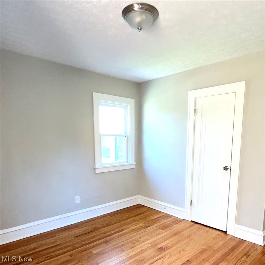 1055 Hillstone Road Cleveland Heights, OH 44121 - Photo 7 of 16 Empty room with light hardwood floors
