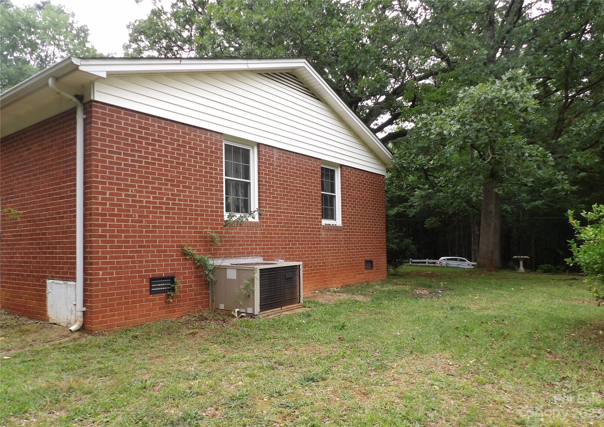 660 Faith Street Lancaster, SC 29720 - Photo 19 of 23 a backyard of a house with lots of green space