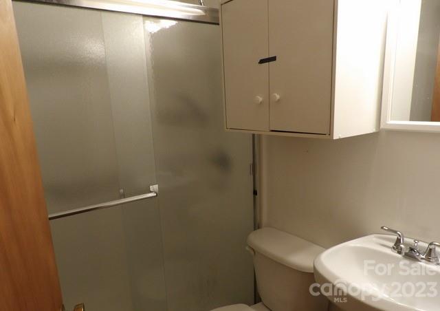 660 Faith Street Lancaster, SC 29720 - Photo 5 of 23 a bathroom with a granite countertop sink toilet and a mirror