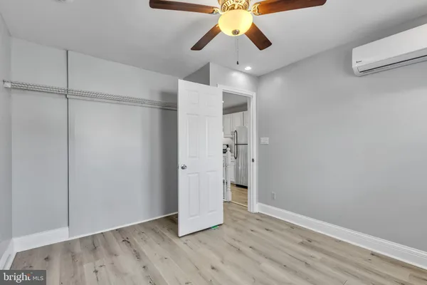 a view of an empty room and wooden floor
