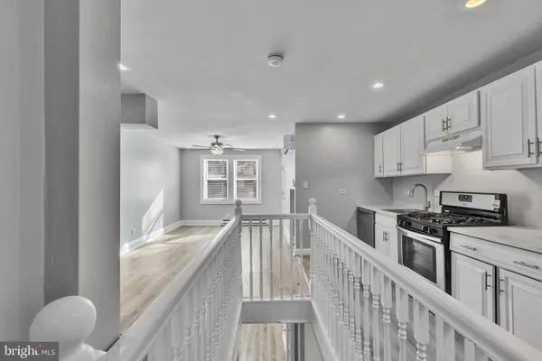 a kitchen with a sink and a refrigerator