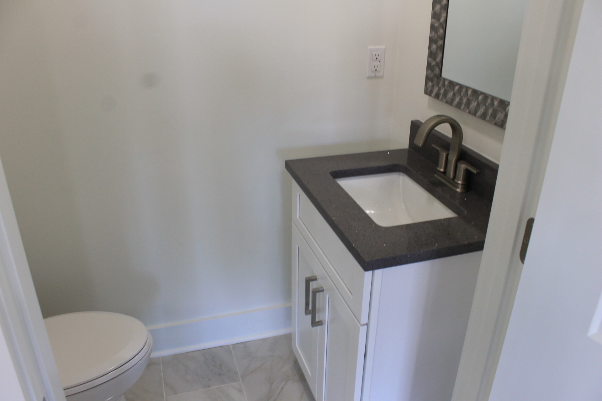 673 Shelton Road Manchester, TN 37355 - Photo 12 of 25 a bathroom with a toilet sink and mirror