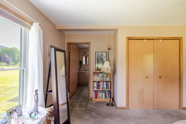 a view of an entryway with a floor to ceiling window