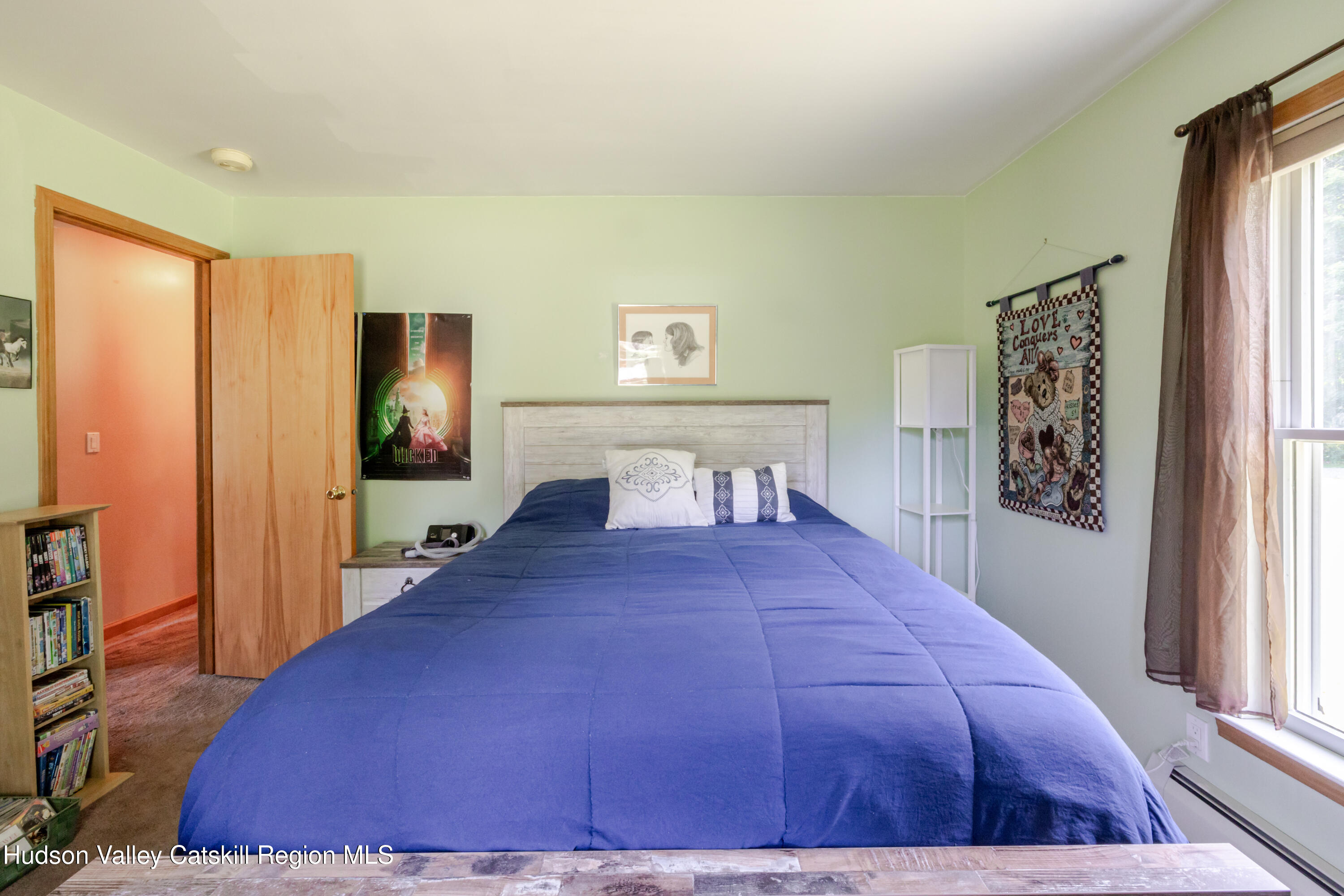 23 Maple Lane Copake Falls, NY 12517 - Photo 23 of 40 a bed room with a bed mirror and a window