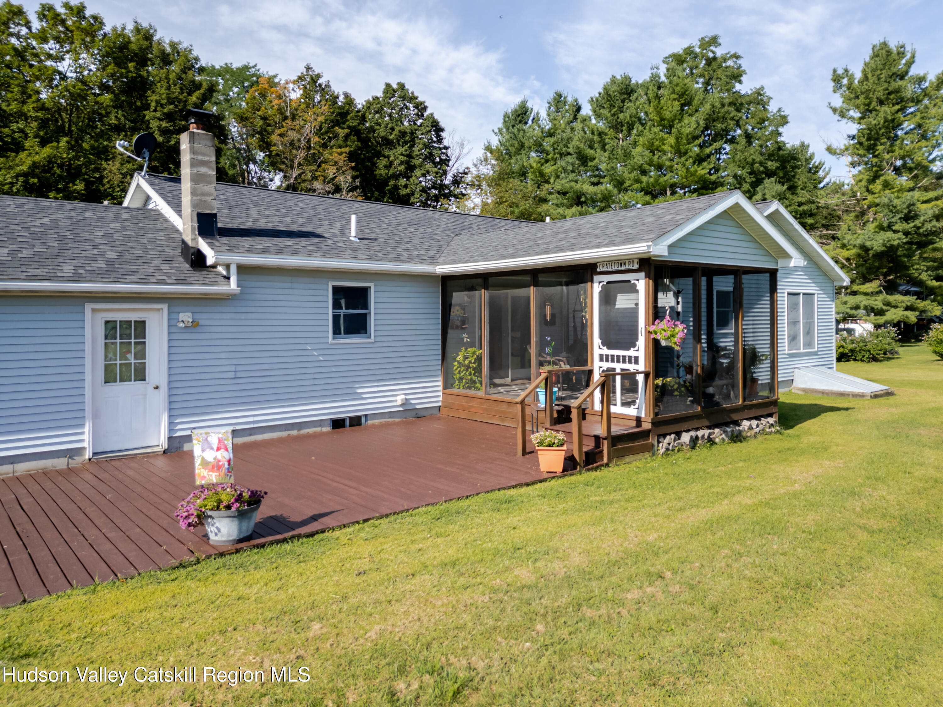 23 Maple Lane Copake Falls, NY 12517 - Photo 30 of 40 a view of a house with backyard porch and sitting area