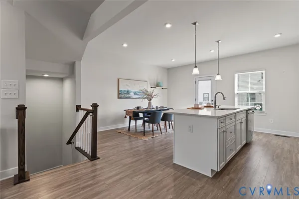 a large kitchen with a table and chairs