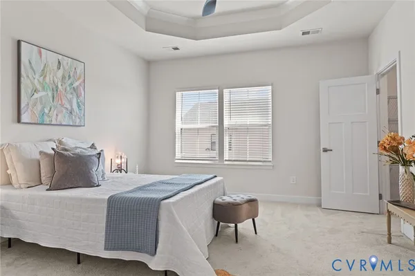 a bedroom with a bed and a chair
