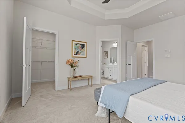 a spacious bedroom with a bed and a table