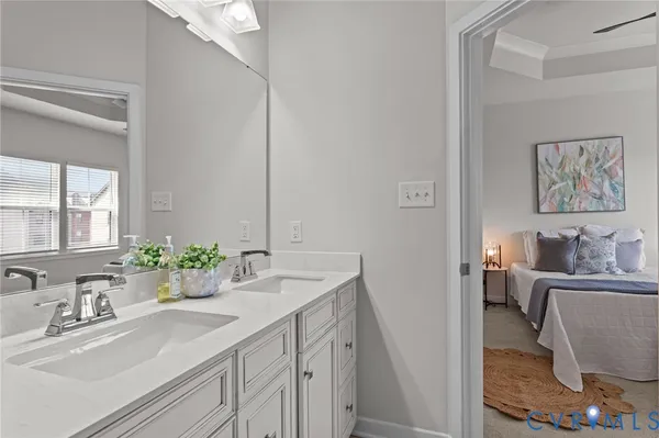 a bathroom with a sink a vanity and a mirror
