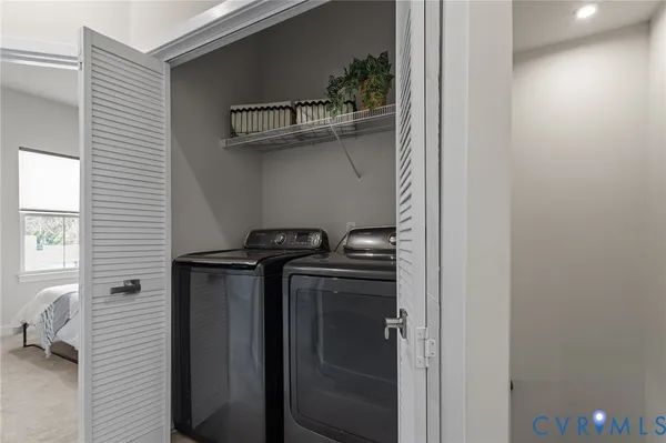 a kitchen with a refrigerator and a stove