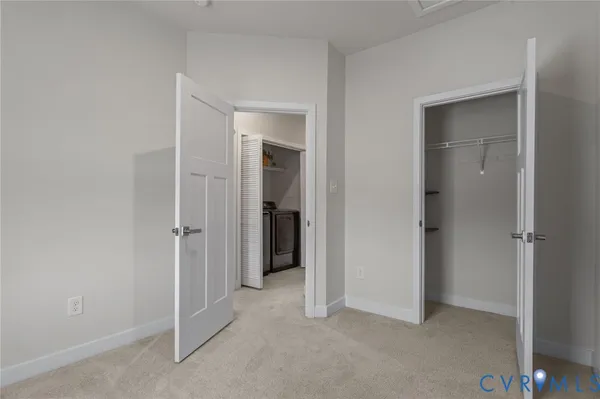 a view of an empty room and closet