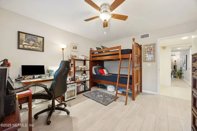 a bedroom with a bed and a couch