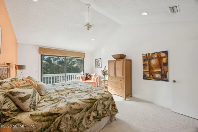 a view of swimming pool with outdoor seating and plants