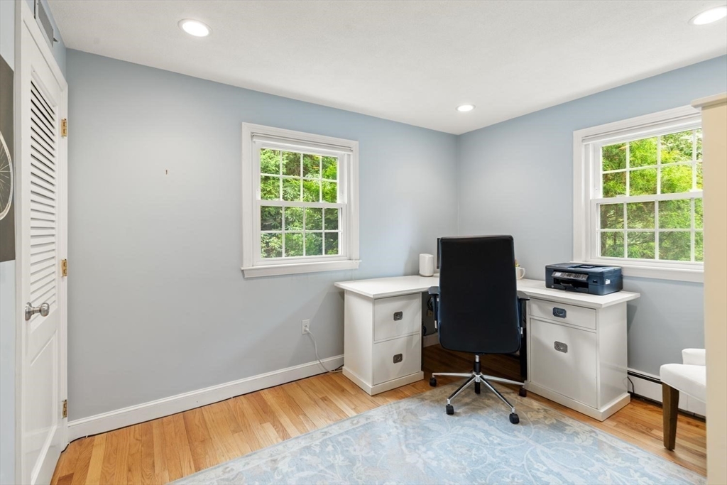 105 Thornberry Road Winchester, MA 01890 - Photo 15 of 35 a view of a workspace with furniture and a window