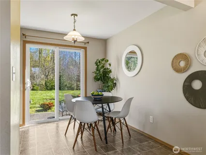 a dining room with furniture and window