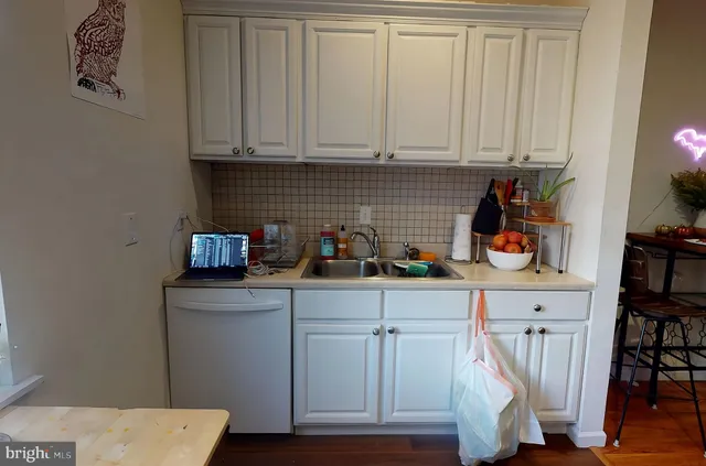 a kitchen with a sink and cabinets