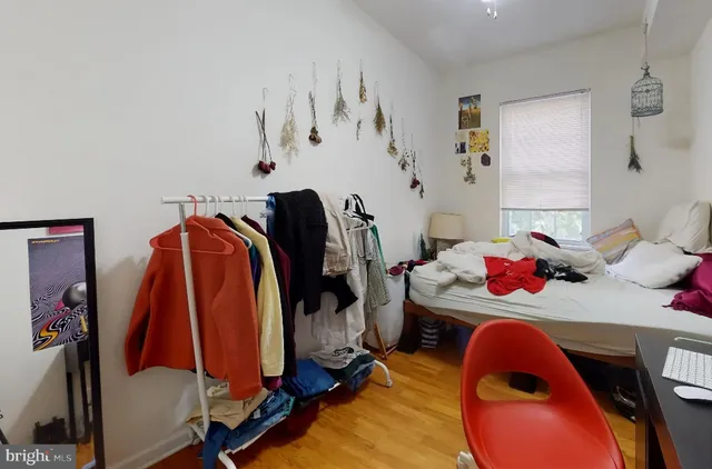 a bedroom with a bed and a closet