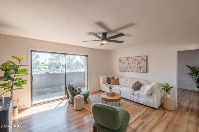 a living room with furniture and a large window