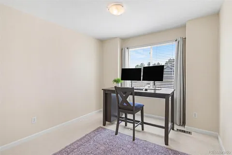 a view of a workspace with furniture
