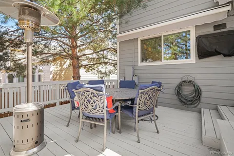 a view of a chairs and table in backyard
