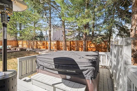 a view of balcony with wooden floor and outdoor seating