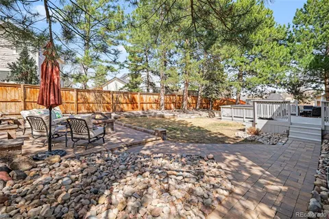 a view of yard with patio