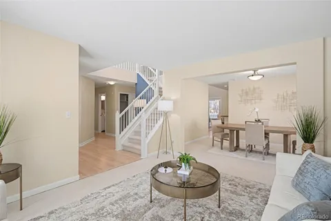 a living room with furniture and a table