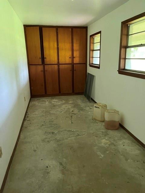 304 Sunset Street Roxton, TX 75477 - Photo 22 of 31 an empty room with windows