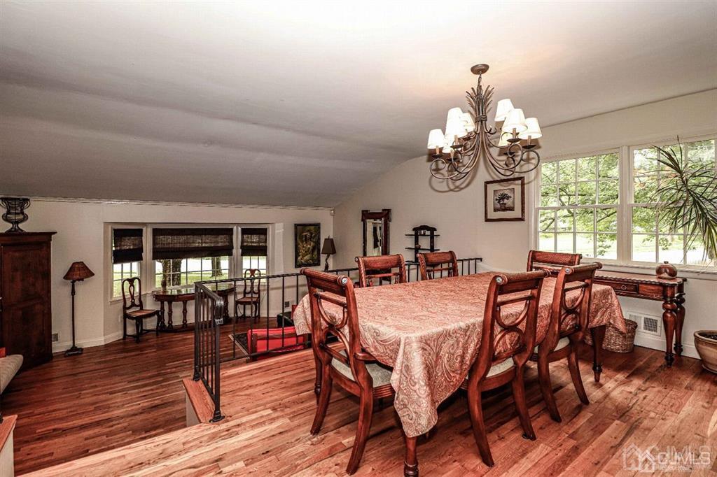 1 Butler Road Edison, NJ 08820 - Photo 15 of 25 a view of a dining room with furniture wooden floor and chandelier
