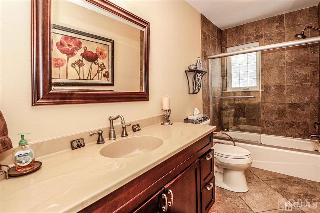 1 Butler Road Edison, NJ 08820 - Photo 18 of 25 a bathroom with a sink a toilet and shower