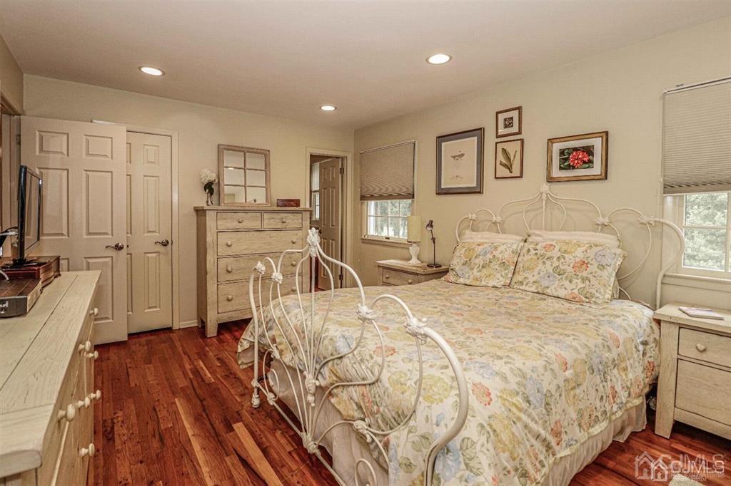 1 Butler Road Edison, NJ 08820 - Photo 19 of 25 a spacious bedroom with a bed and a flat screen tv