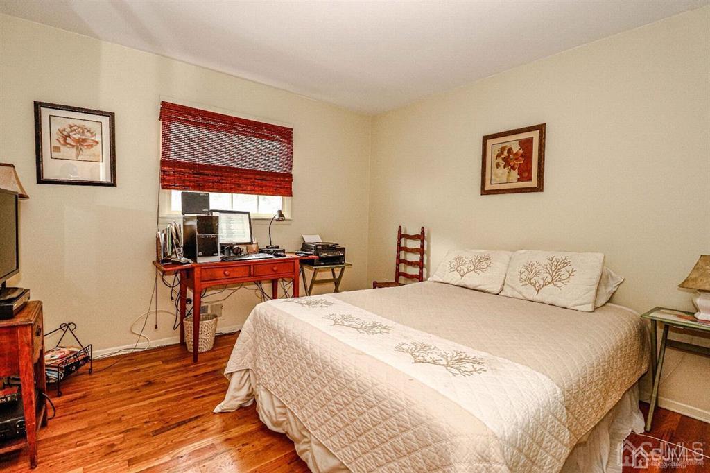 1 Butler Road Edison, NJ 08820 - Photo 21 of 25 a bedroom with a bed and wooden floor