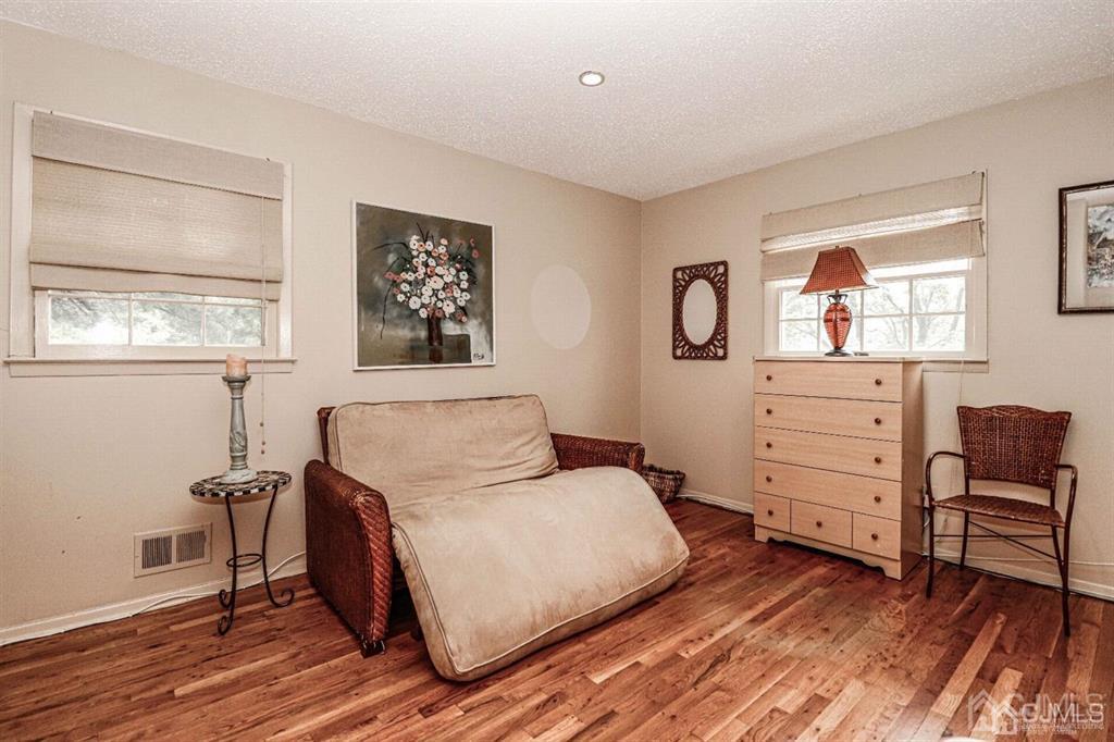 1 Butler Road Edison, NJ 08820 - Photo 22 of 25 a bedroom with a bed and a dresser