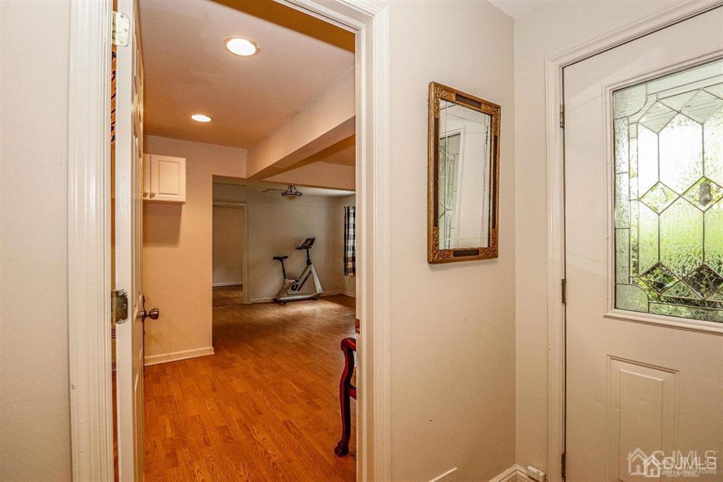 1 Butler Road Edison, NJ 08820 - Photo 3 of 25 a view of a hallway with wooden floor and living room