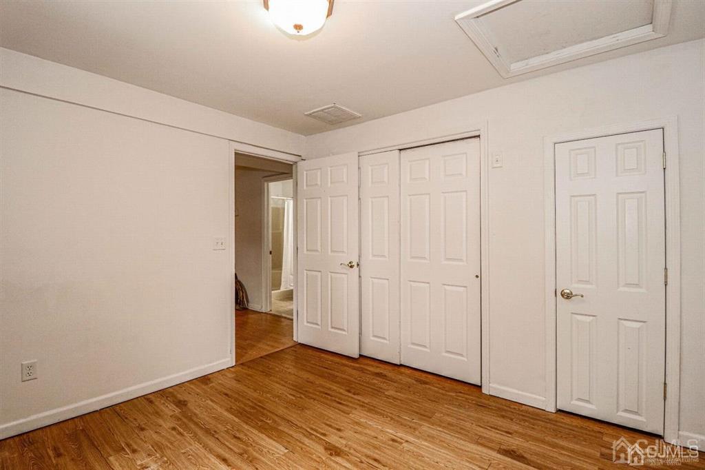 1 Butler Road Edison, NJ 08820 - Photo 6 of 25 a view of an empty room with wooden floor