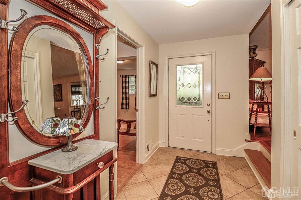 1 Butler Road Edison, NJ 08820 - Photo 8 of 25 wooden floor with a table and a mirror