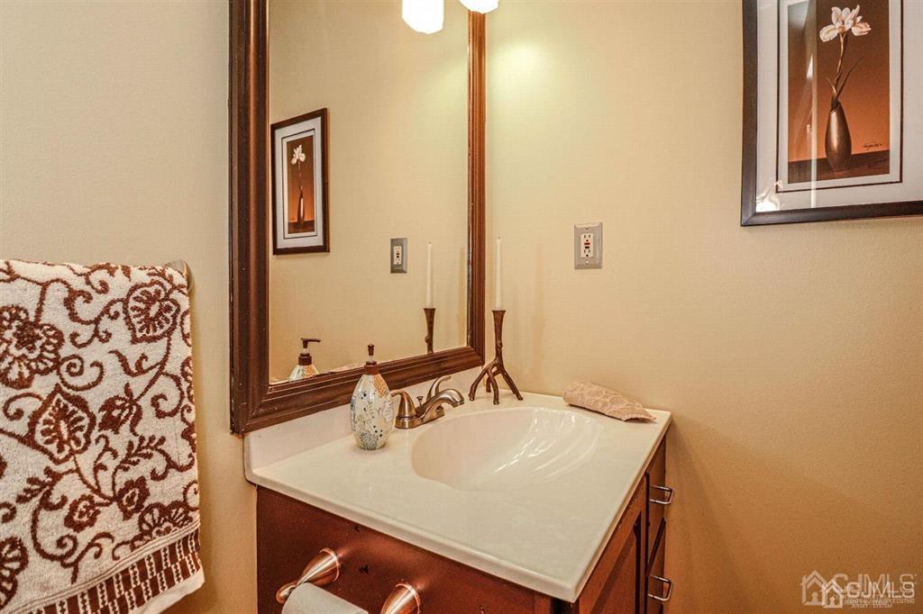 1 Butler Road Edison, NJ 08820 - Photo 9 of 25 a bathroom with a sink and a mirror