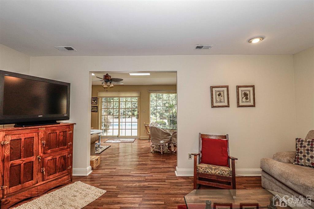 1 Butler Road Edison, NJ 08820 - Photo 10 of 25 a living room with furniture and a flat screen tv