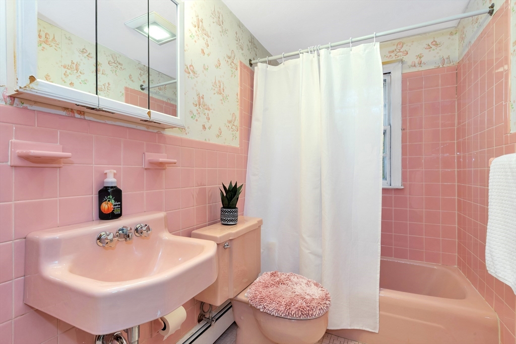 19 Wilbur Avenue Arlington, MA 02476 - Photo 21 of 32 a bathroom with a sink a toilet a mirror and shower