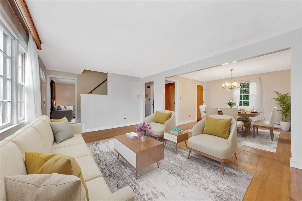 19 Wilbur Avenue Arlington, MA 02476 - Photo 7 of 32 a living room with furniture and a large window