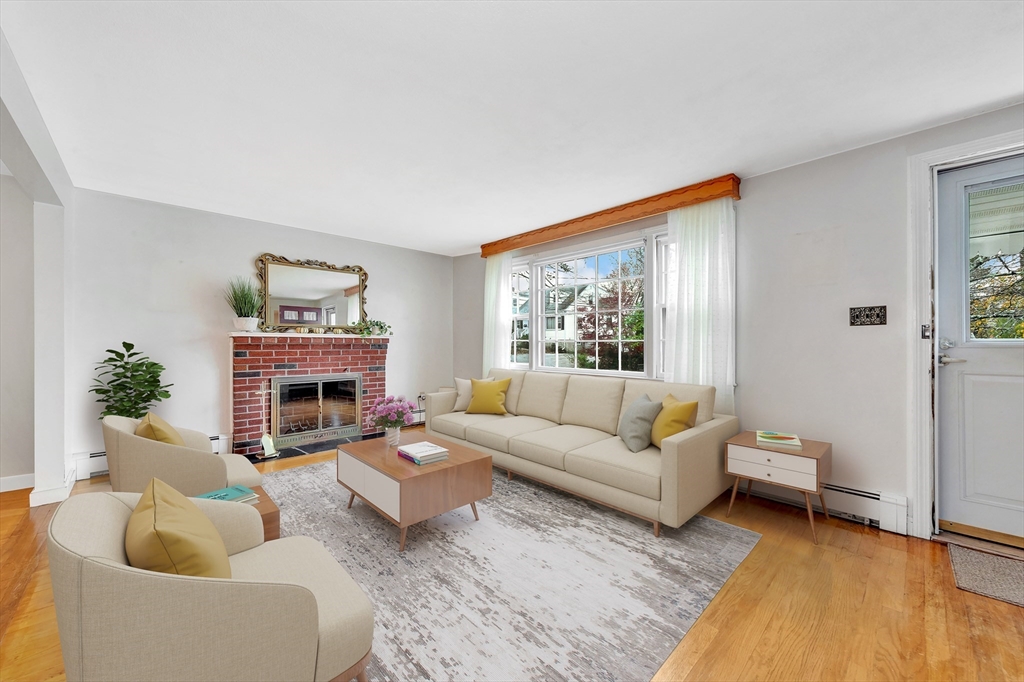 19 Wilbur Avenue Arlington, MA 02476 - Photo 8 of 32 a living room with furniture and a fireplace