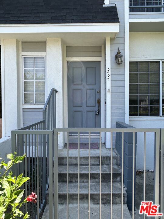 7430 Corbin Avenue, Unit 33 Reseda, CA 91335 - Photo 2 of 28 a view of front door and wooden door