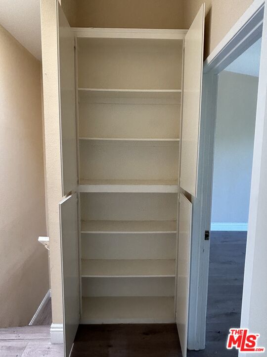 7430 Corbin Avenue, Unit 33 Reseda, CA 91335 - Photo 21 of 28 a view of walk in closet with empty racks